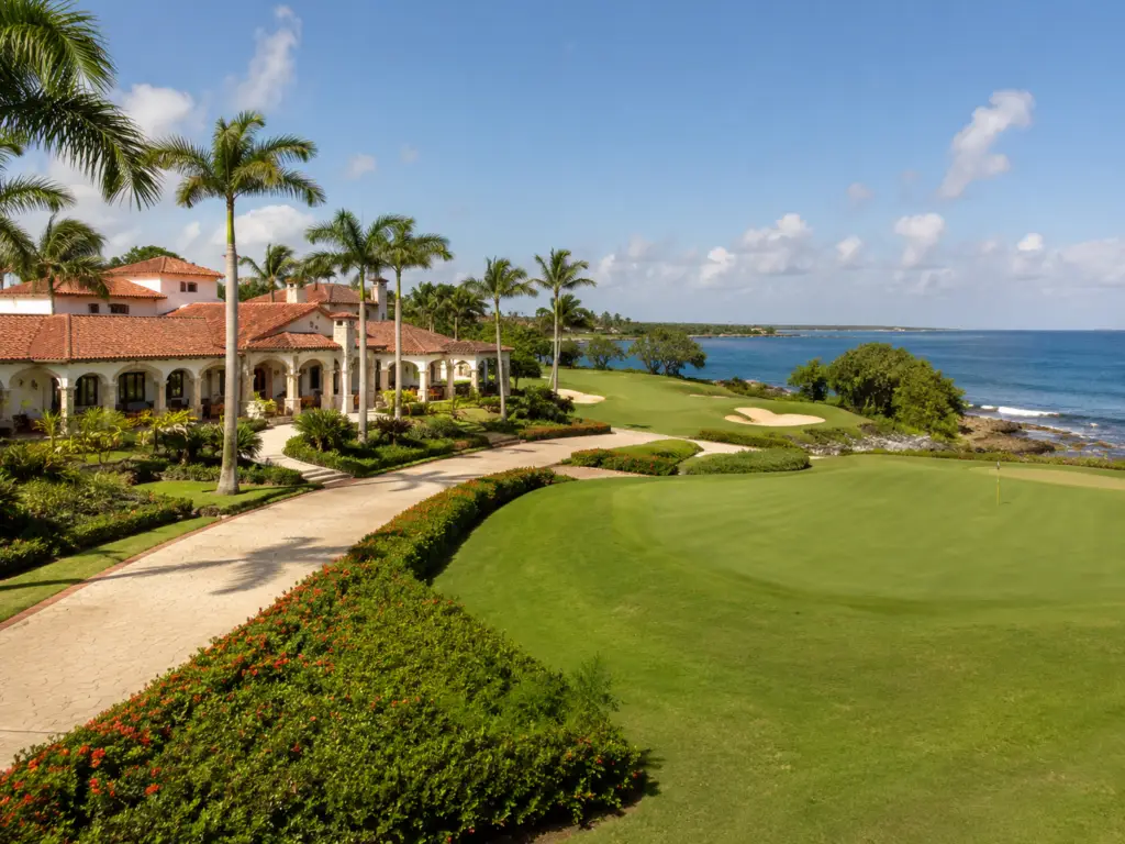 Teeth of the Dog golf course green with Caribbean Sea views and Casa de Campo resort villas in the Dominican Republic